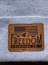 Load image into Gallery viewer, Close up of Freedom Flannel American logo suede patch. 
