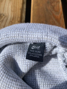 Close up of manufacturers tag. Made in the U.S.A., 40% recycled wool, 60% acrylic. 