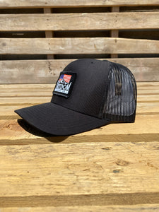 Side profile of Black/Black American Flag Freed Flannel patch hat. 