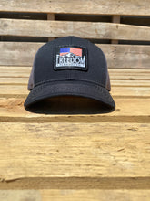 Load image into Gallery viewer, charcoal/black American flag Freedom Flannel logo patch hat on a Richardson 112 low profile trucker snap back hat. 
